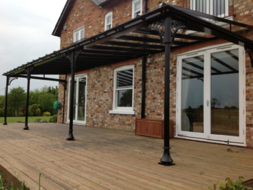 <p>Fixed through the decking to concrete pads below, this Verandah in Yorkshire shows our plain Trumpet bases with our fluted column and lattice quarter arches.</p>
