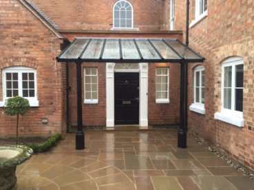 <p>Maybe a little larger than your average porch; this stunning covered entrance needed to make a statement at this large, country home. Featuring our Whitworth columns, finished in black. </p>
