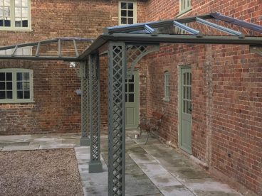 <p>Using our Lattice columns, this "L" shaped Verandah features two, bespoke hipped sections and a single valley to the internal corner to follow the line of the existing building. Installed for our well-known clients in Dorset, completed 2019.</p>
