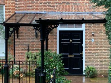 <p>A challenging design for a member of a European Royal family living in Surrey, completed in 2018. Using our V8 columns with circles quarter arches, finished in black. </p>
