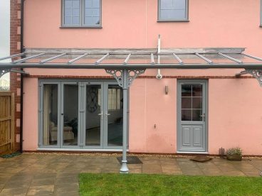 <p>This installation, using trumpet columns with circles quarter arches was completed in January 2021 near Bristol. Finished in RAL7001 to match the doors and windows on the property. </p>
