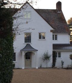 <p>This porch features our lattice columns with matching arches and a GRP (fibreglass) lead-effect roof. A worthy addition to this stylish Surrey home. </p>
