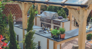 An outdoor kitchen surrounded by plants